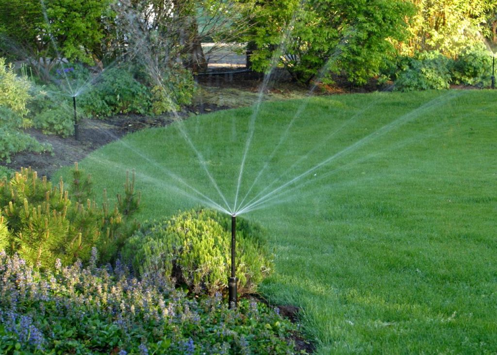 When should you turn on your sprinkler system in the spring