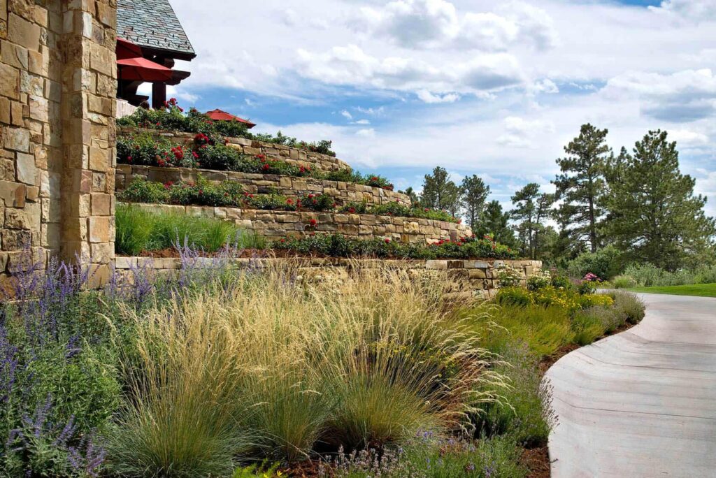 high end clubhouse entry gate and driveway landscape