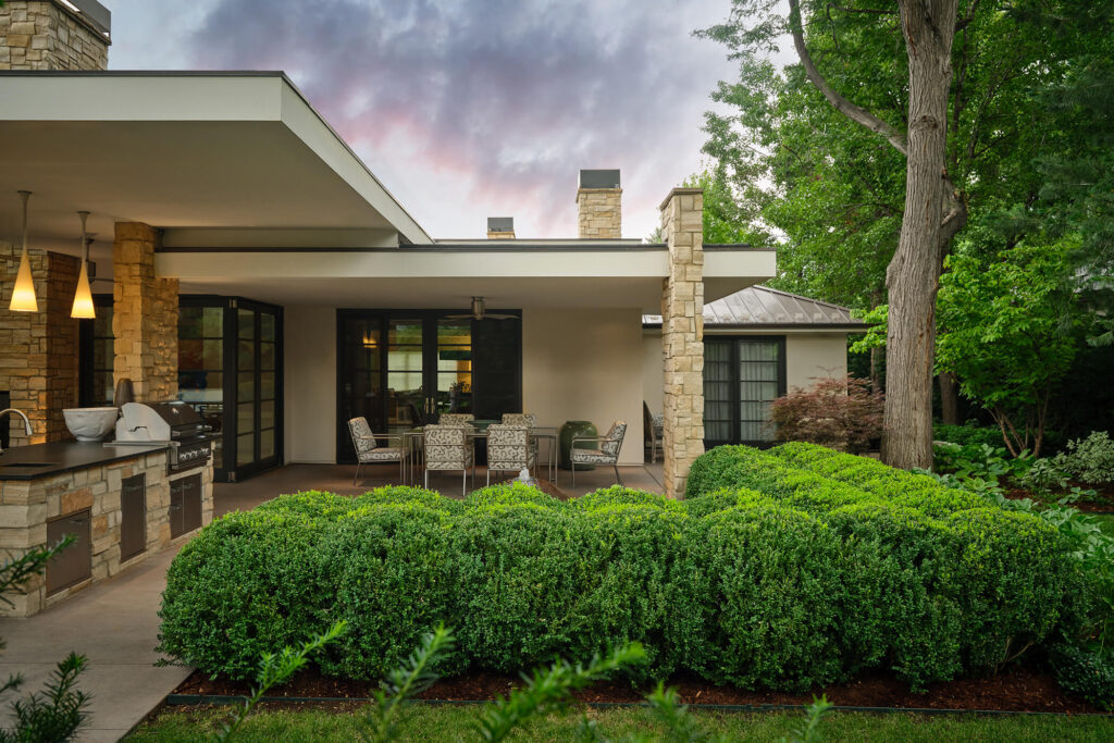 precise sheared hedges and formal planting beds detail